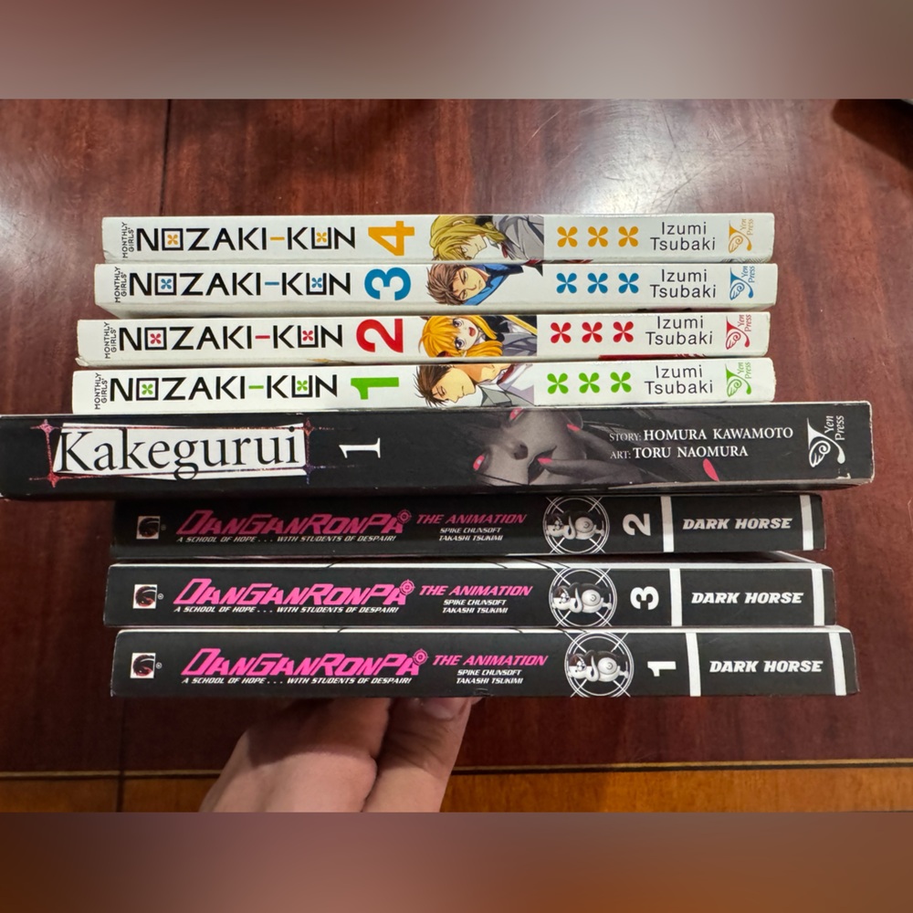 Manga Collection with Black, White, and Red Covers